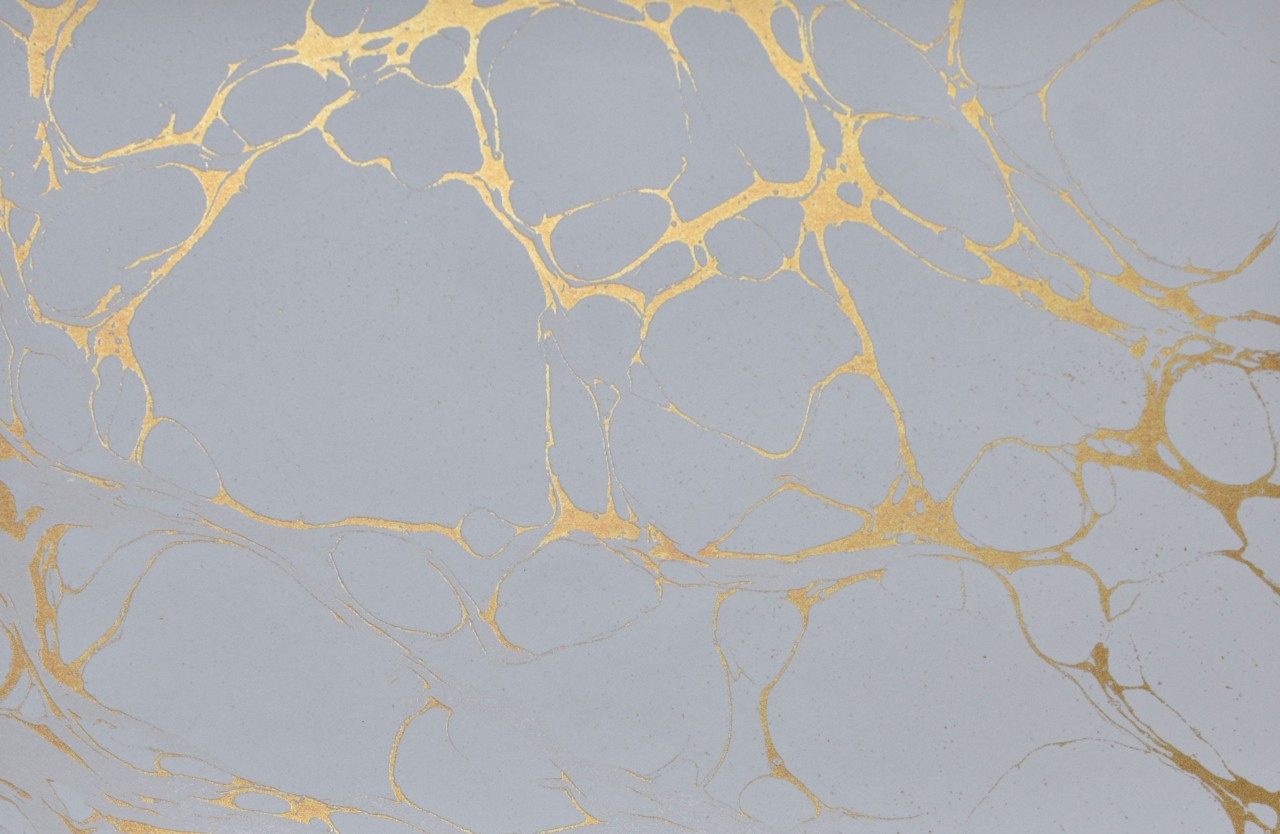 Gold marbled texture on gray background