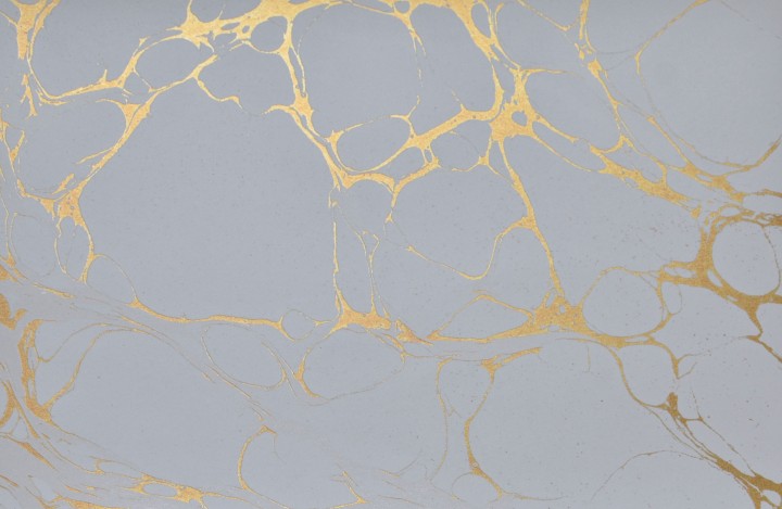 Gold marbled texture on gray background