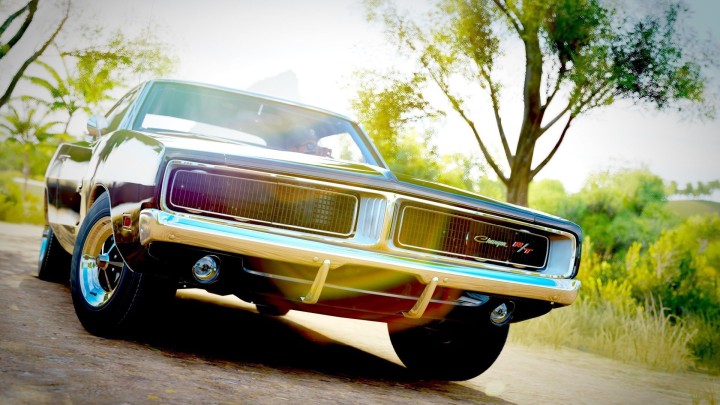 Red Dodge Charger doing burnout on road