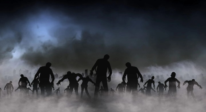 Silhouettes of zombies under a full moon and clouds