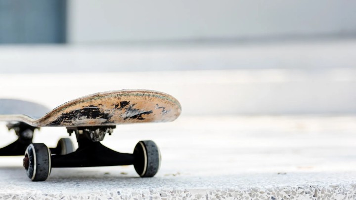 Skateboard on road at night under streetlights