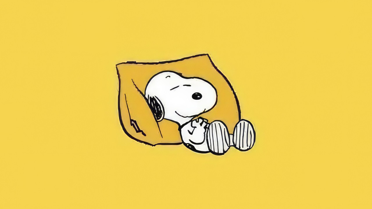 Snoopy sleeping on a yellow pillow simple background