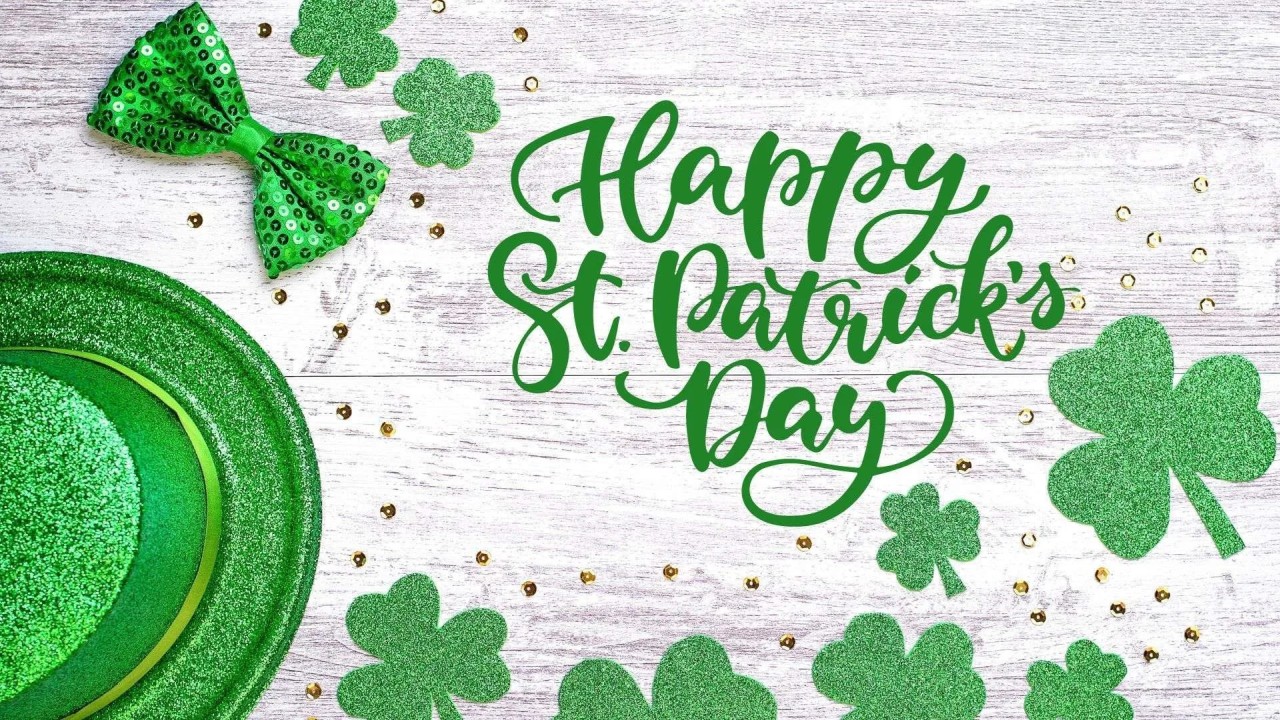 St Patricks Day text hat shamrocks on green