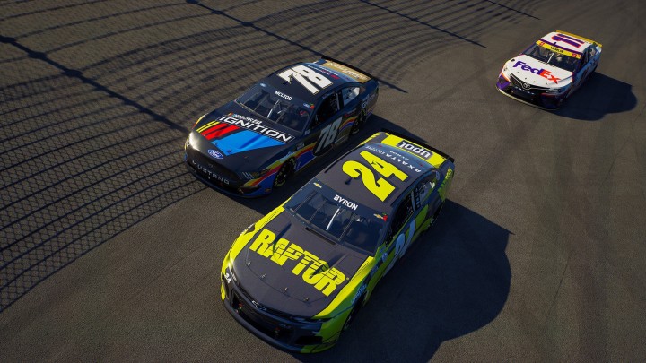 Three NASCAR stock cars on racetrack