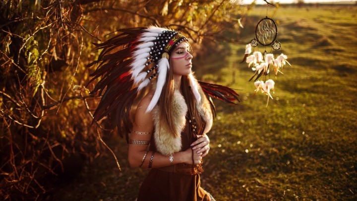 Woman in headdress and face paint