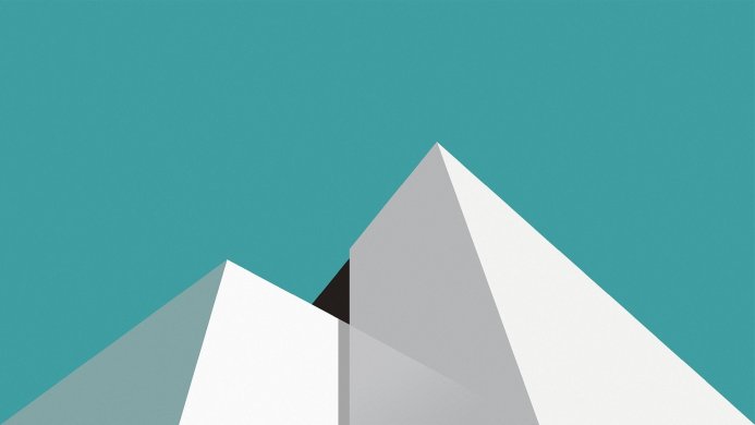 Abstract image of white pyramids against a teal background