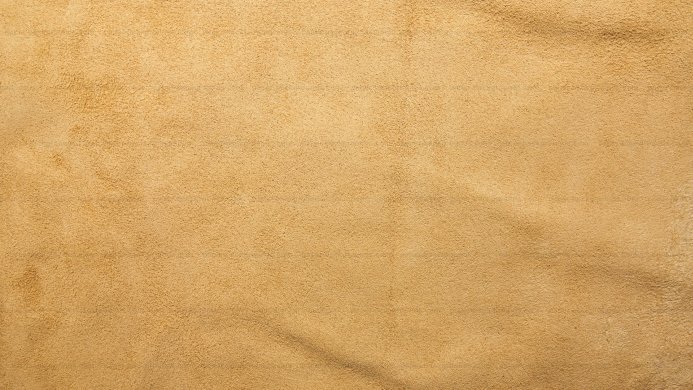 Close-up of beige suede fabric texture