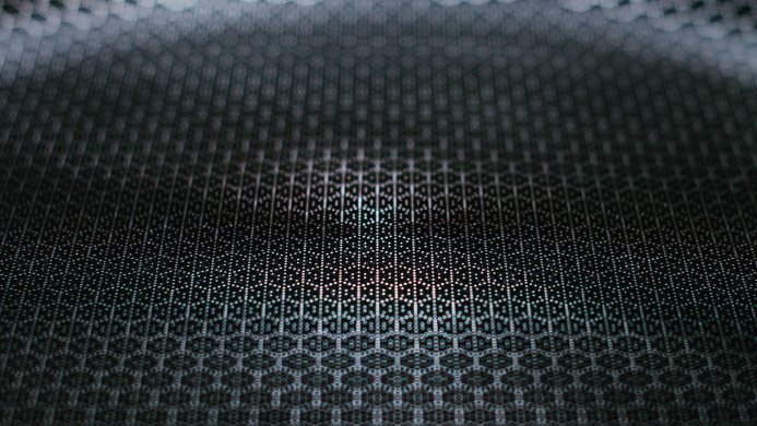 Close-up of a black honeycomb pattern with shades of grey and white