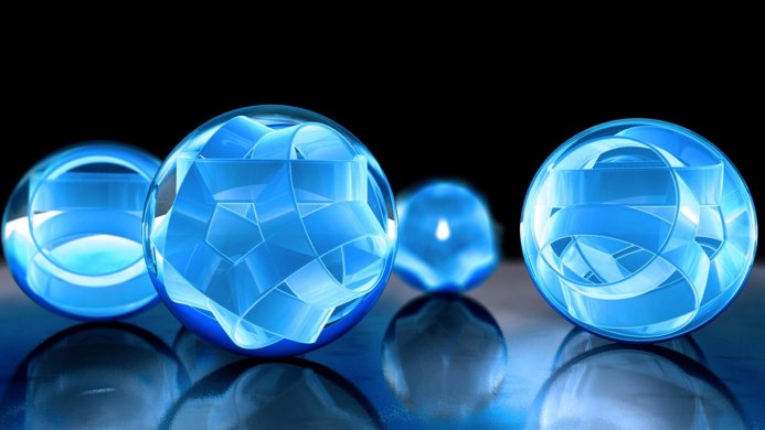 Abstract image of translucent blue glass spheres on a reflective surface against a black background