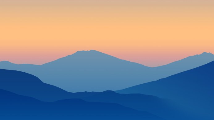 Blue mountains layered against a gradient orange and pink sky