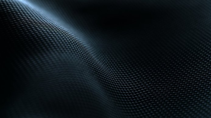 Close-up of a textured carbon fiber surface with blue tones