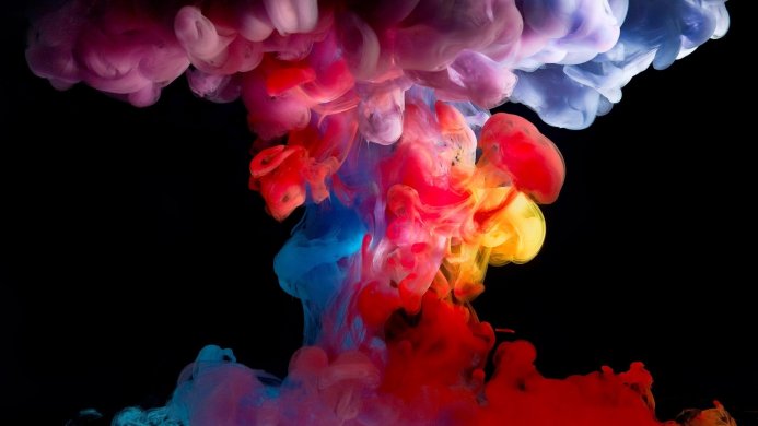 Colorful ink cloud in water on a black background