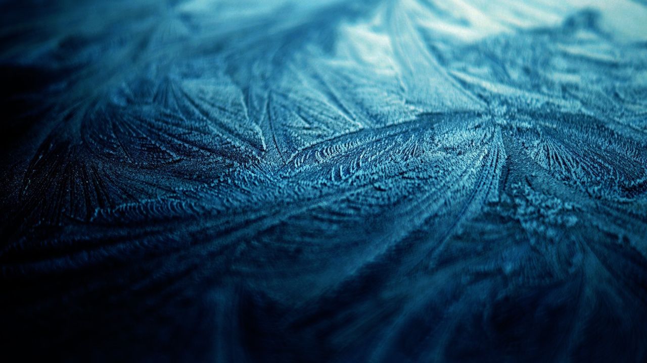 Blue frost patterns on a window