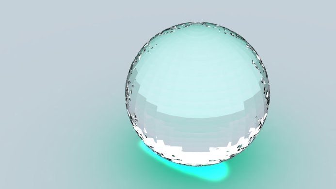A transparent glass sphere on a light blue background
