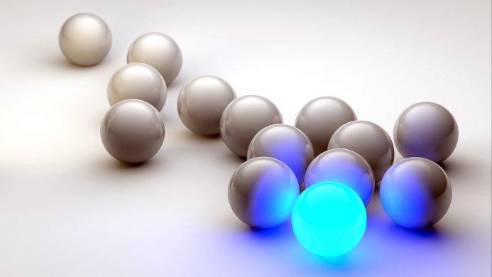 Group of gray spheres with a single glowing blue sphere