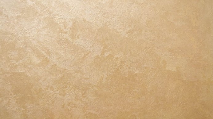 Close up of a golden beige wall texture