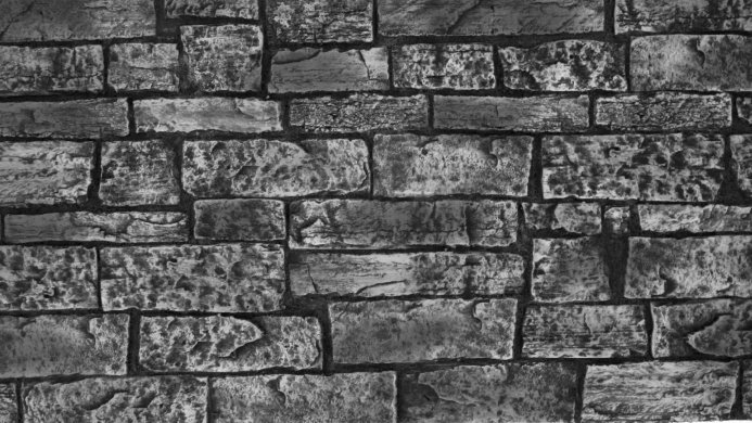 Monochrome brick wall texture background in black and white