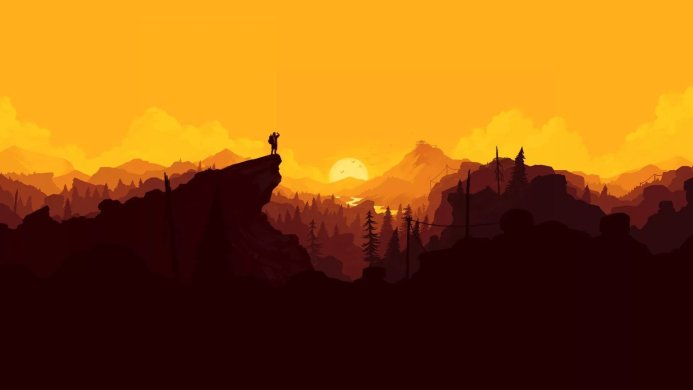 Silhouette of a person standing on a cliff overlooking mountains and a forest at sunset