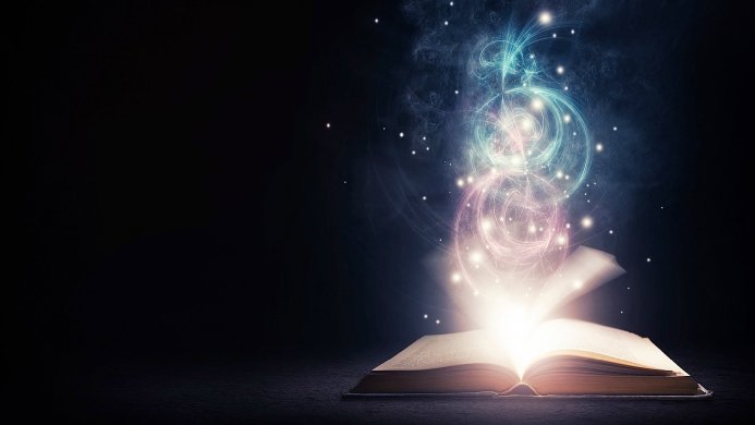An open book with glowing swirls and sparkles emanating from it