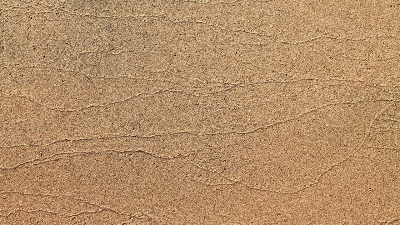 Close up of sandy texture with wavy patterns