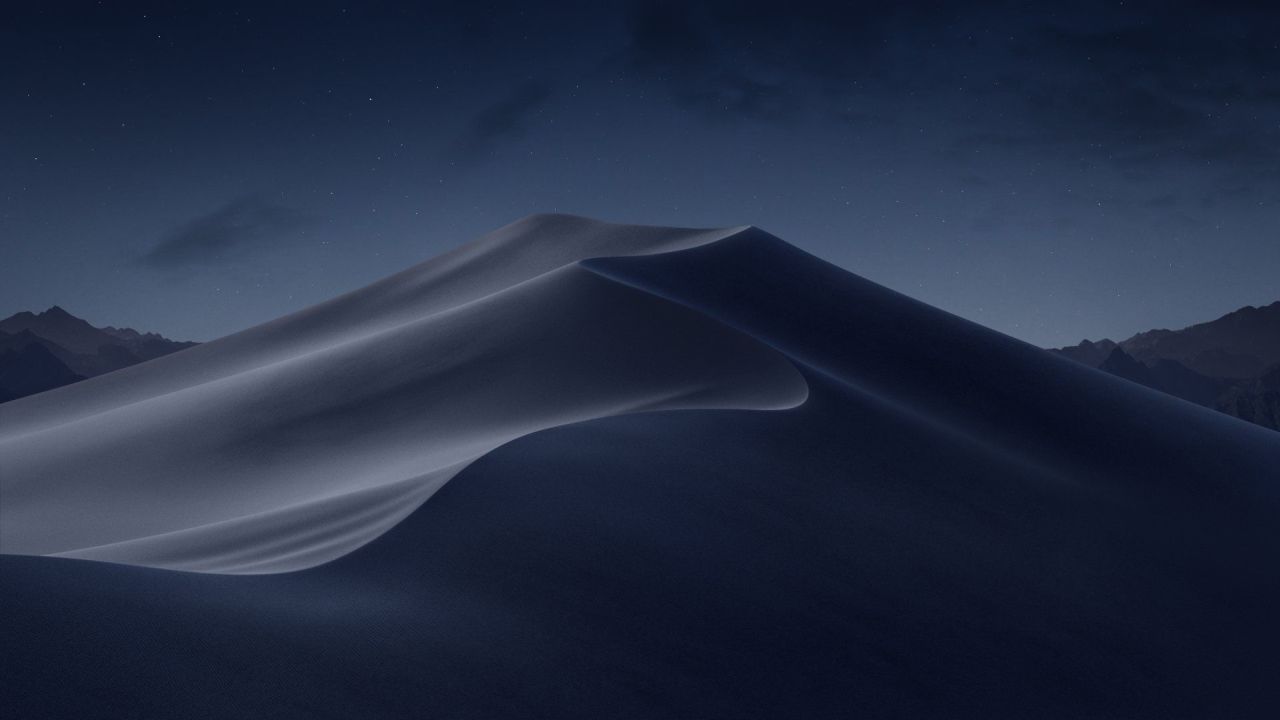 Sand dunes at night under a starry sky