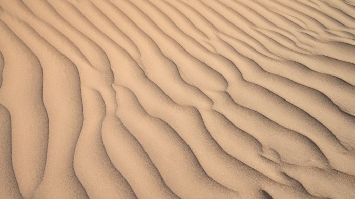 Close-up of rippled sand dunes in a desert landscape