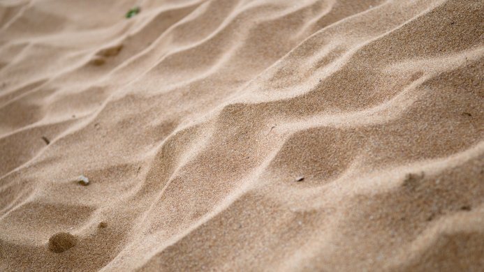 Close-up of rippled sand texture on a beach