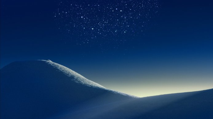 Snow dunes under a starry sky with a gradient of blue and yellow