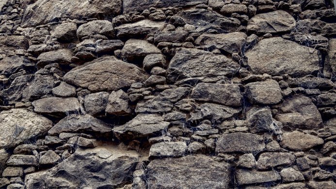 Old stone wall texture, gray and brown stones