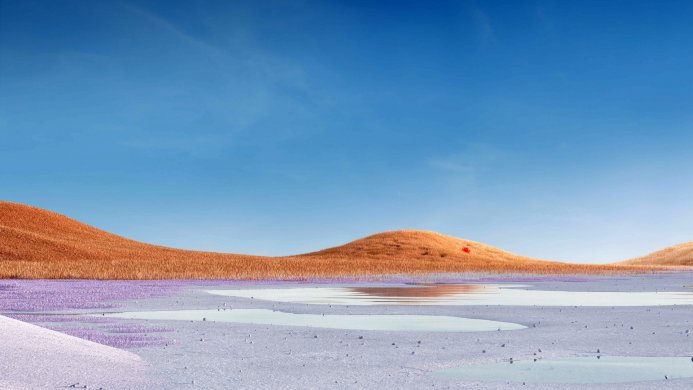 Surreal landscape with orange hills and a body of water under a blue sky