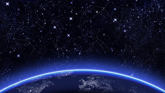 Earth from space with visible constellations against a dark blue starry sky