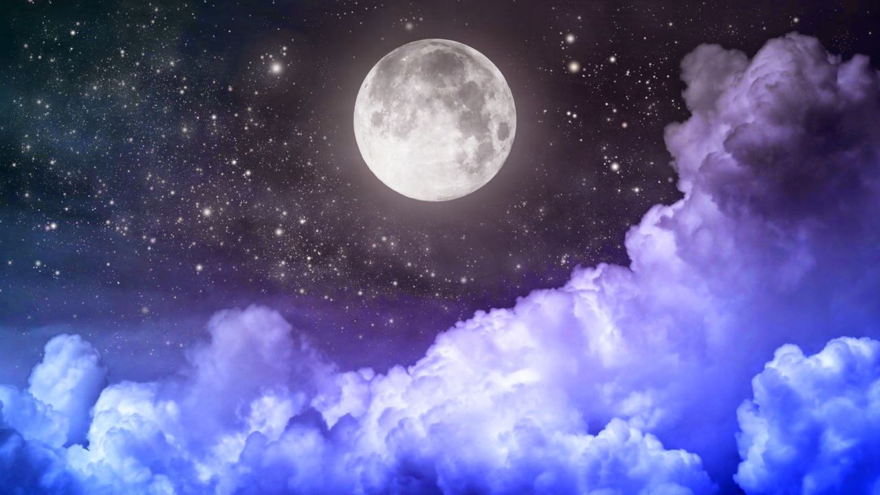 Full moon with clouds and stars