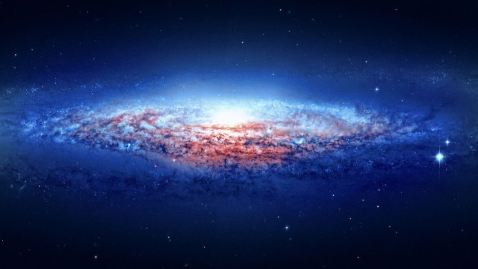 A stunning image of a galaxy with bright blue and red hues and a multitude of stars