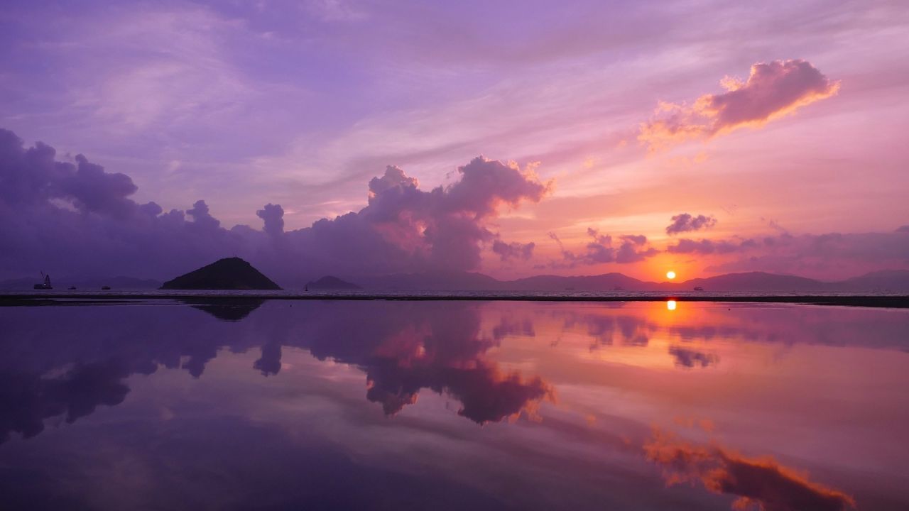 Purple sunset reflecting on water