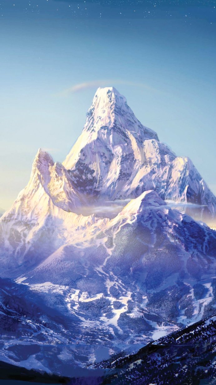 Snow-covered mountain range under a bright sky