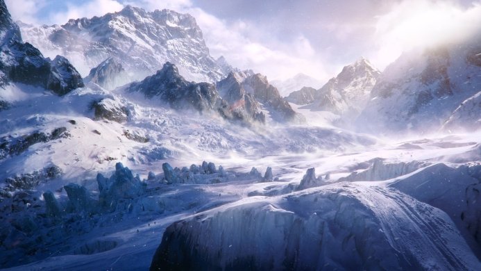 Snowy mountain range with glaciers under a bright sky