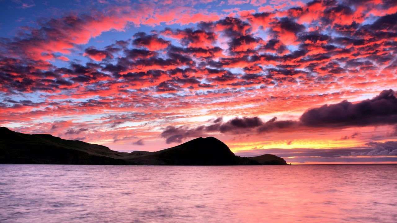 Vivid sunset with clouds over the sea