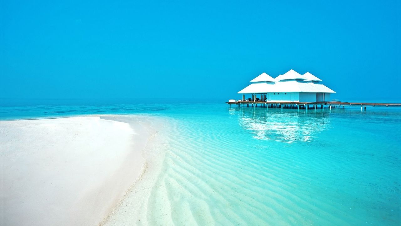 White house on clear turquoise water