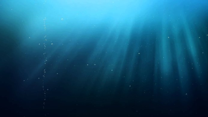 Underwater scene with light rays and bubbles rising