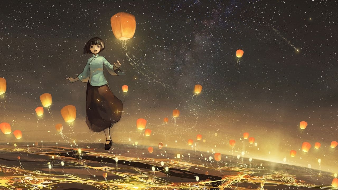 Young girl with sky lanterns at night