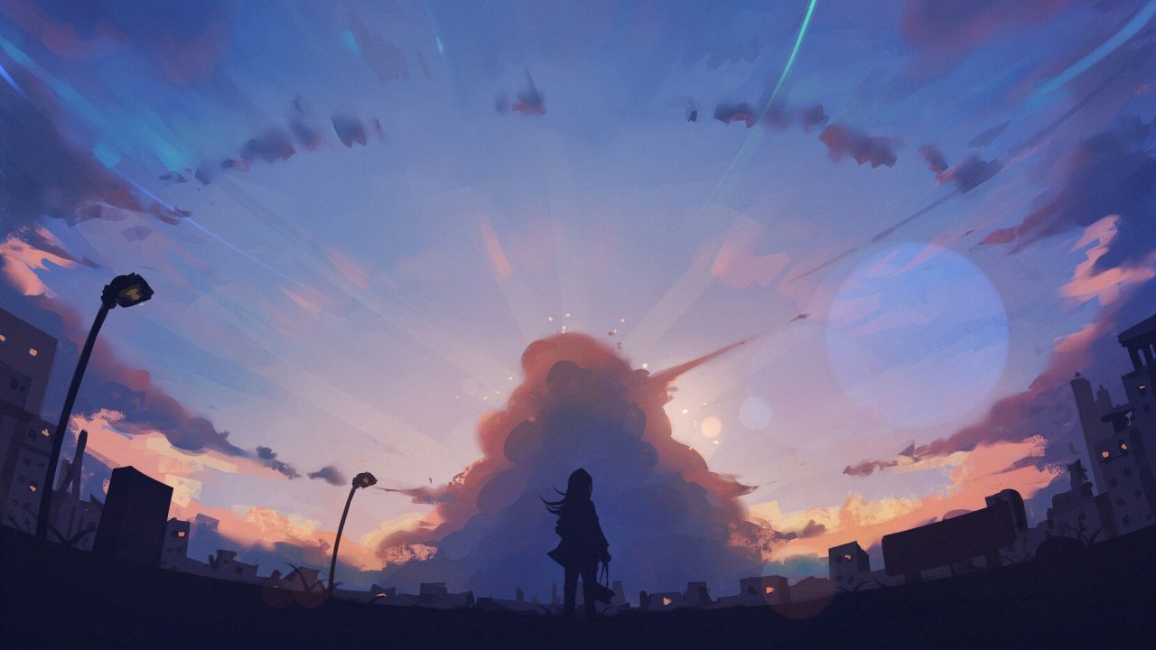 Silhouette of a girl looking at a large cloud sunset sky