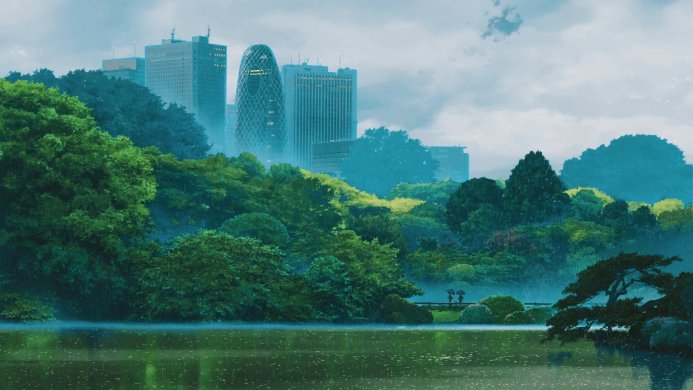 Cityscape with lush trees surrounding a lake on a rainy day