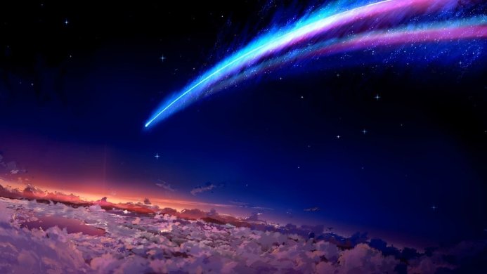 A vibrant comet streaking across a night sky with clouds below