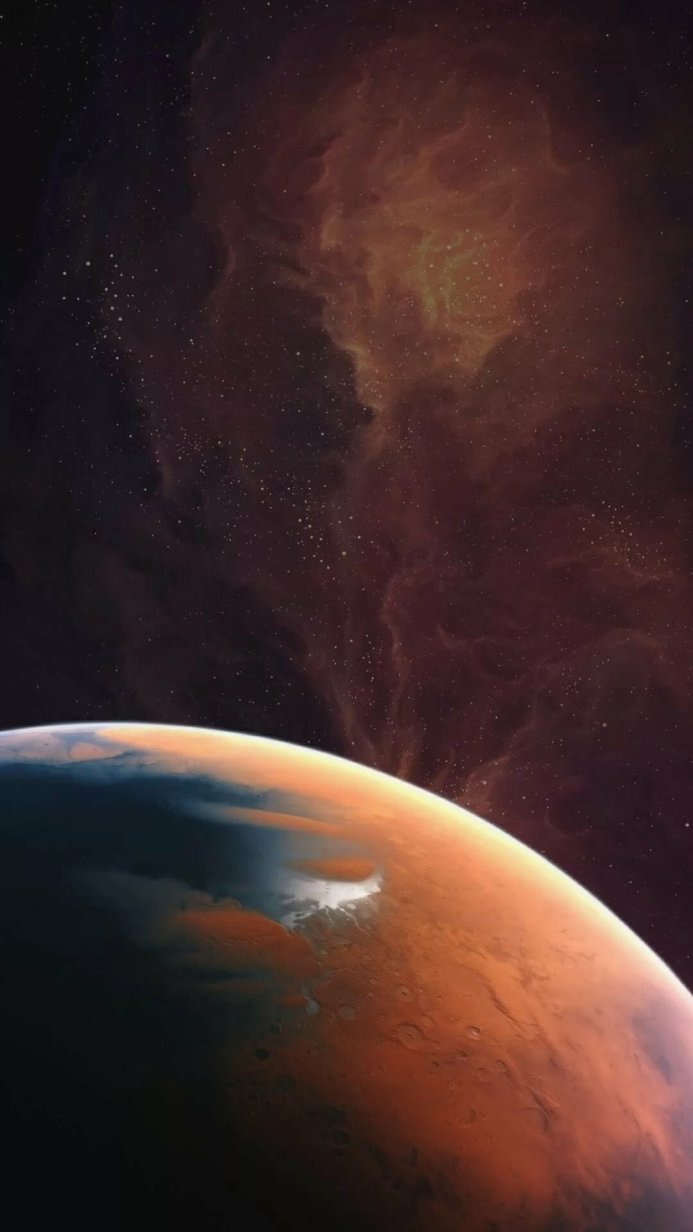 A planet with an orange surface and a nebula in the background