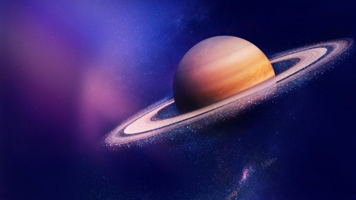 Saturn with its rings against a cosmic background of purple and blue nebulae