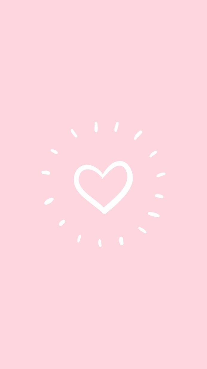 White heart with rays on a pink background