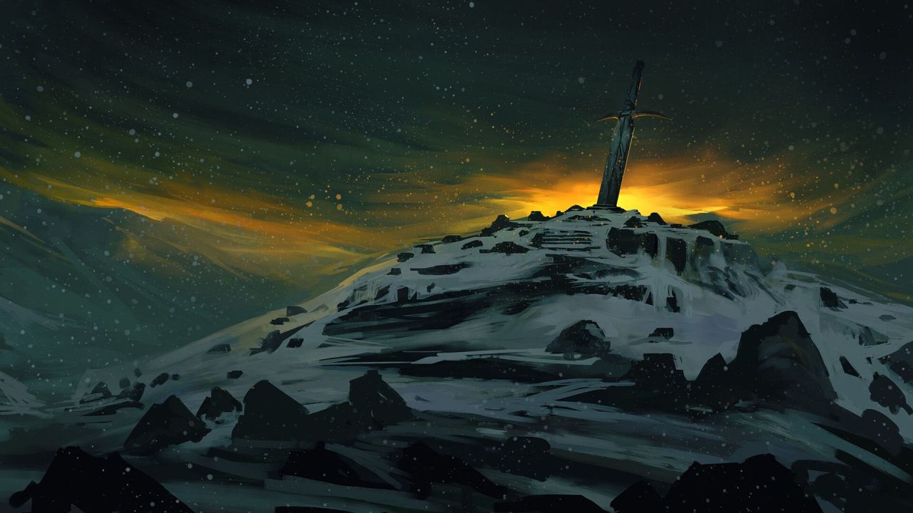 Sword in snowy mountain peak at sunset