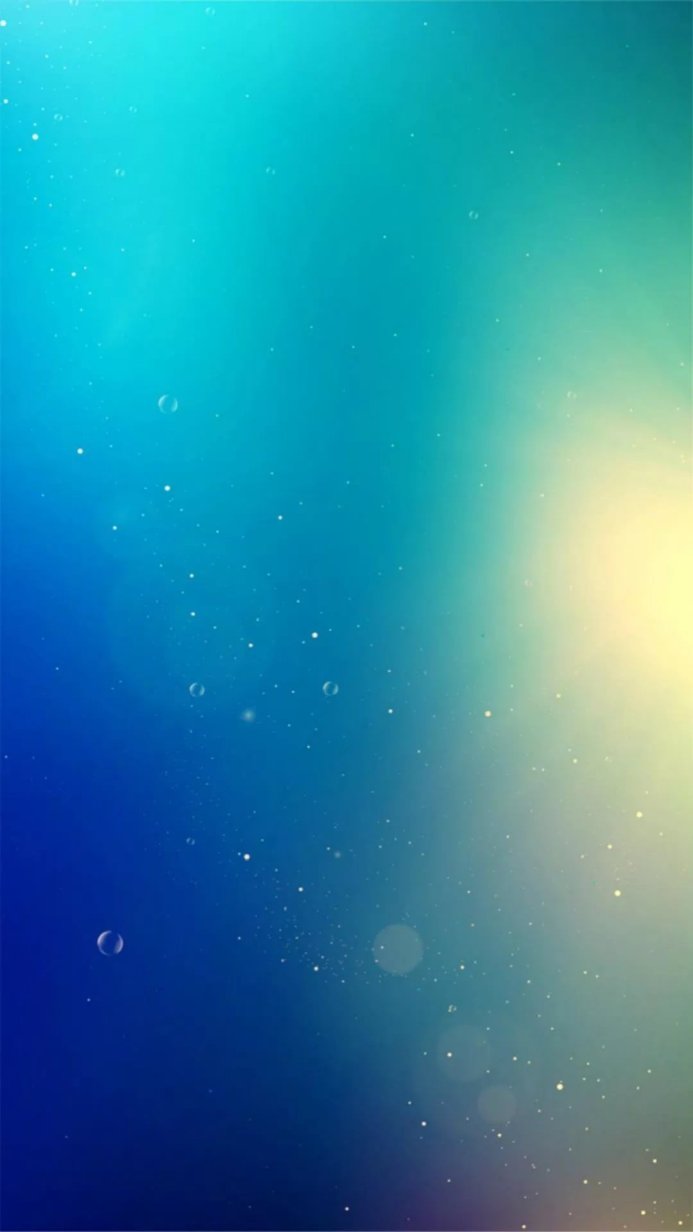 Abstract blue and teal background with bubbles and sparkles