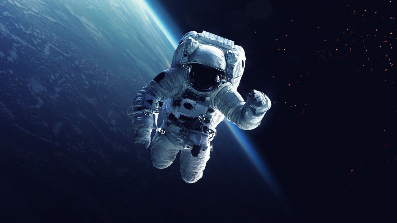 Astronaut in spacesuit near Earth