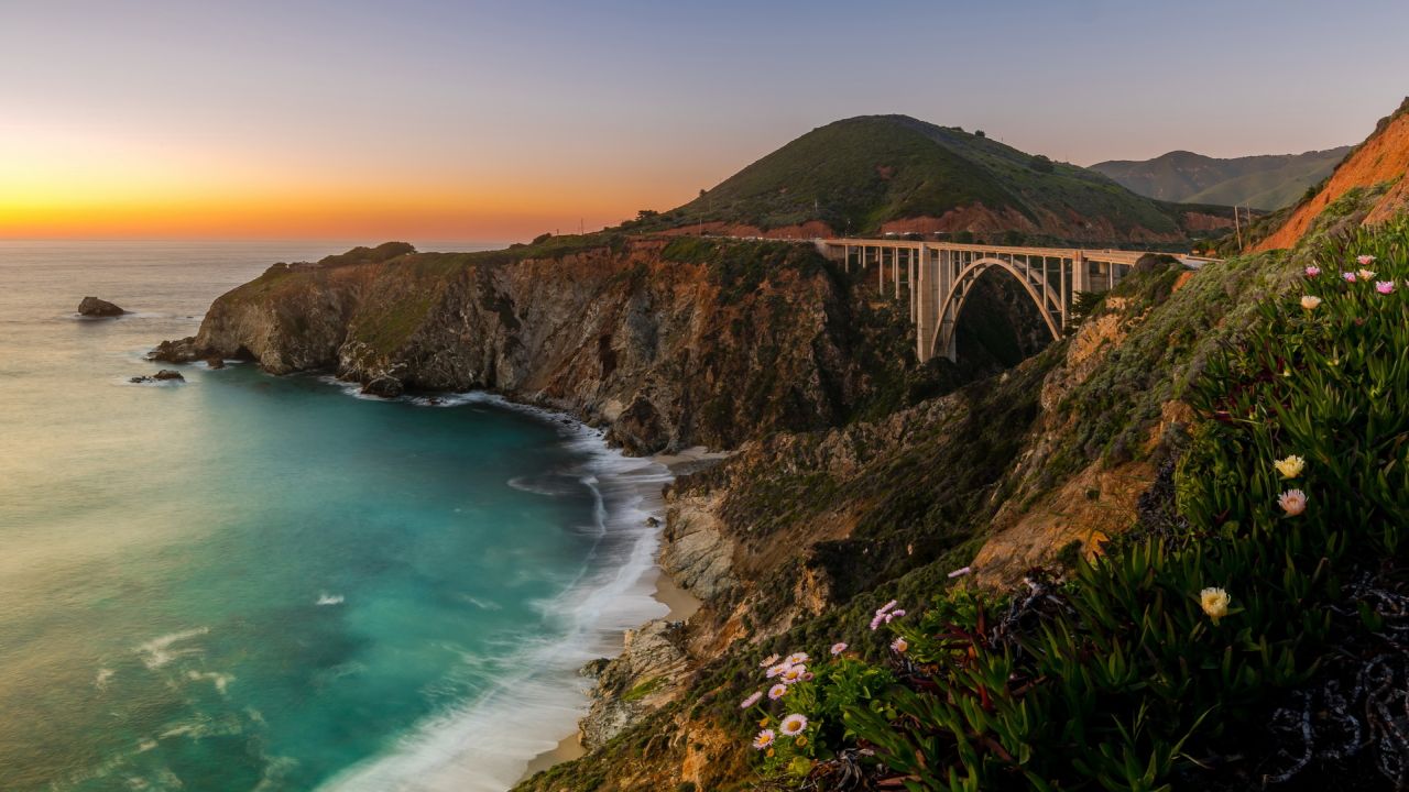 Bixby bridge at sunset with flowers